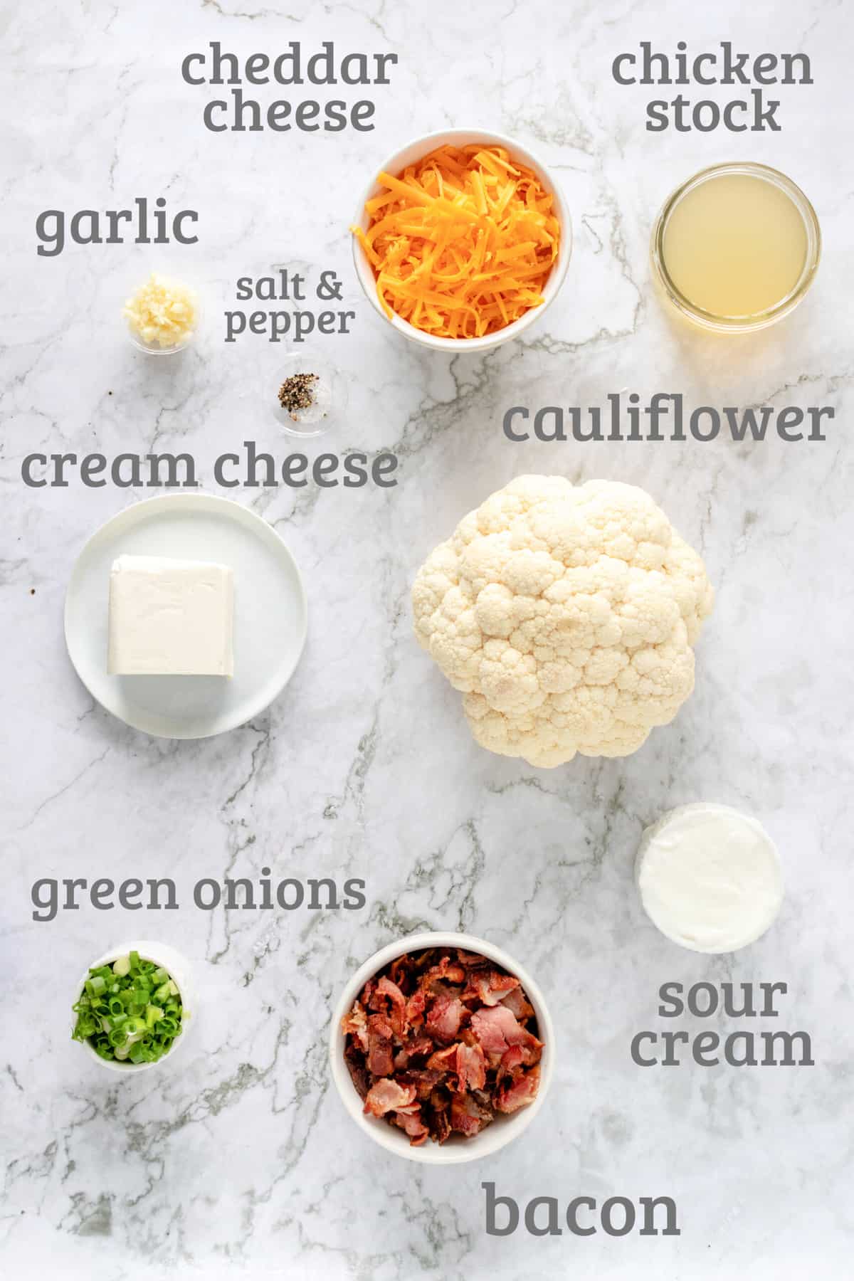 ingredients for loaded cauliflower casserole - cauliflower, bacon, cheese, onions, sour cream