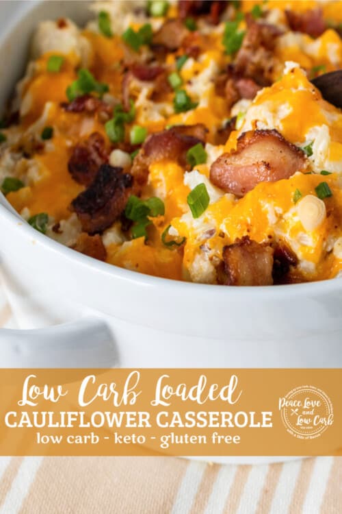white casserole dish with a twice baked cauliflower with bacon, cheese, and green onions