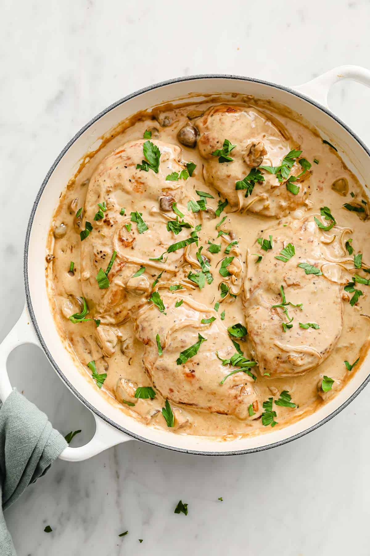 cast iron skillet with chicken with balsamic cream sauce, onions and mushrooms,