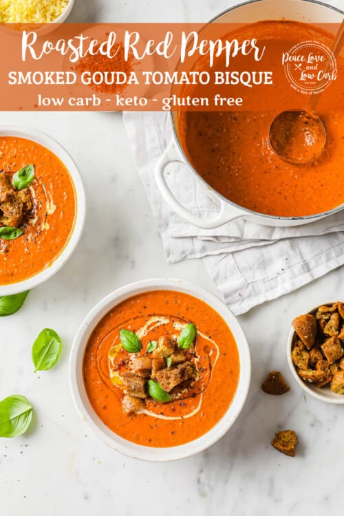 2 bowls of low carb tomato soup, garnished with keto croutons, fresh basil and a swirl of cream