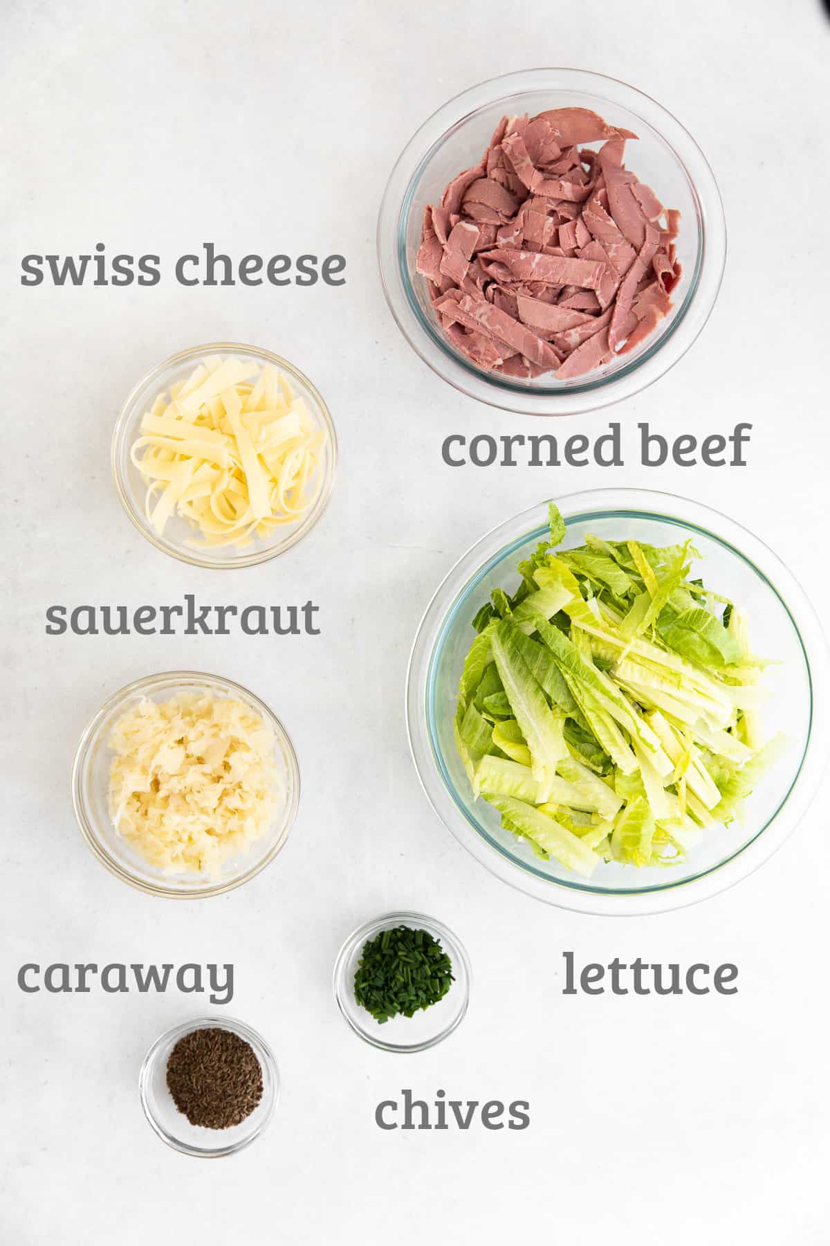 Ingredients for Reuben Chopped Salad - romaine, corned beef, sauerkraut, caraway, chives