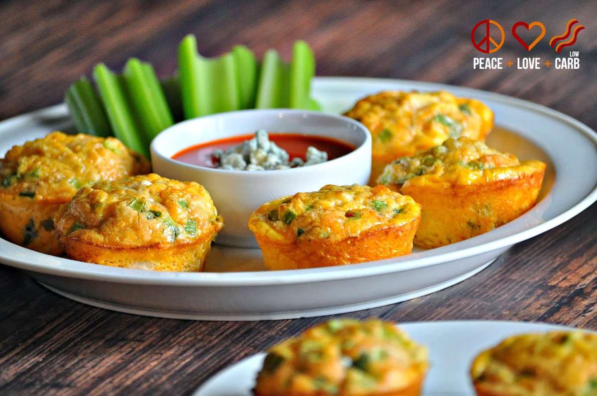 Buffalo Chicken Egg Muffins on a white plate, served with celery and blue cheese