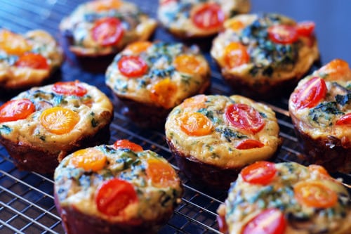 Prosciutto Wrapped Mini Frittata egg Muffins on a wire cooling rack