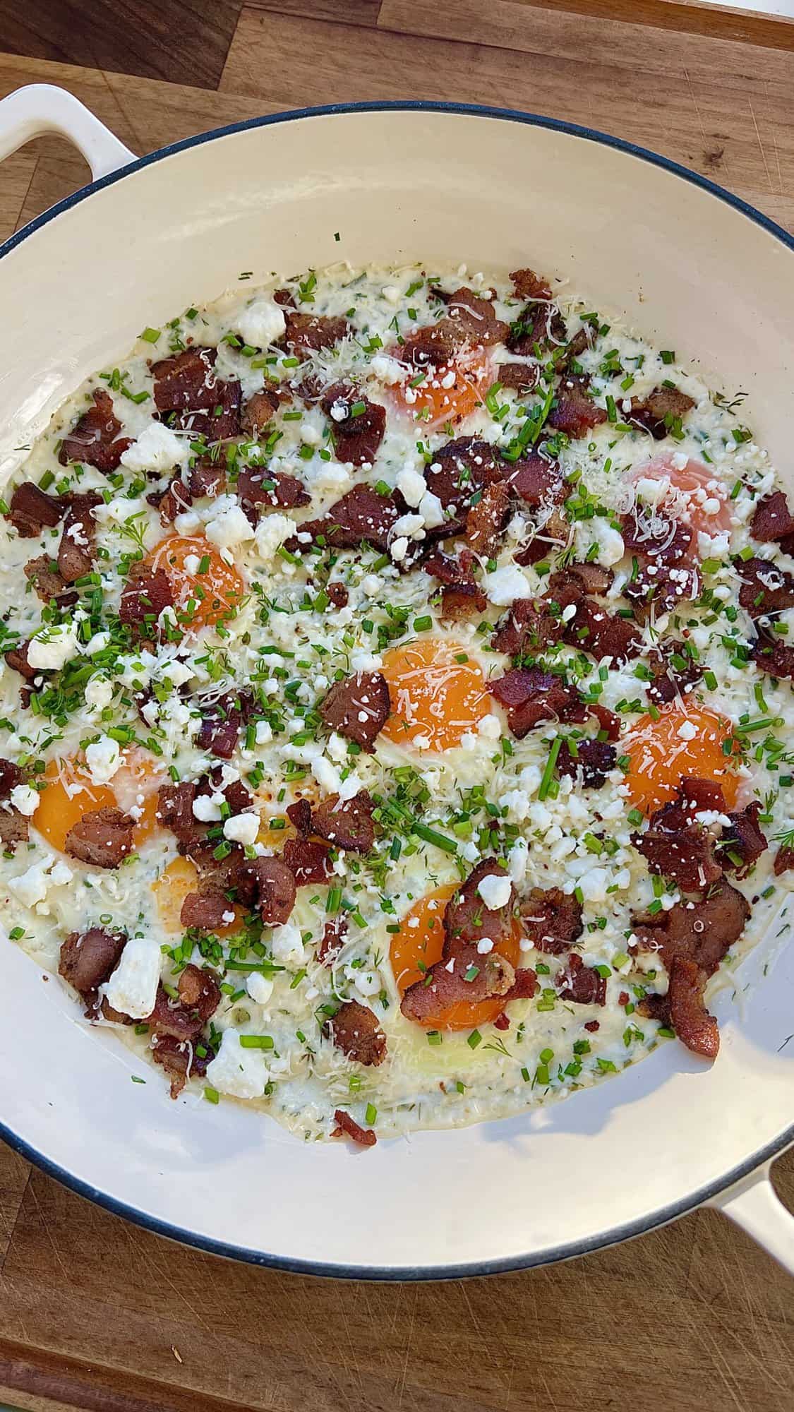 A skillet breakfast made with heavy cream, sour cream, bacon, garlic, and fresh herbs.