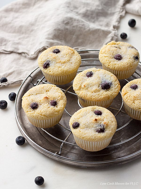 blueberry muffins fresh out of the oven on a wire cooling rack