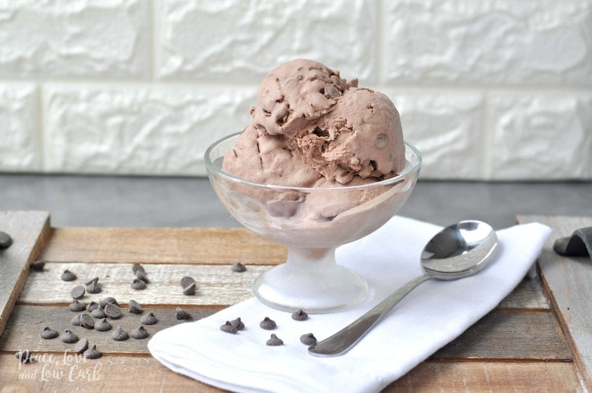 an ice cream dish full of chocolate ice creams, with chocolate chips all around it