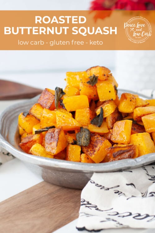 A metal serving dish with a side of roasted butternut squash with sage.