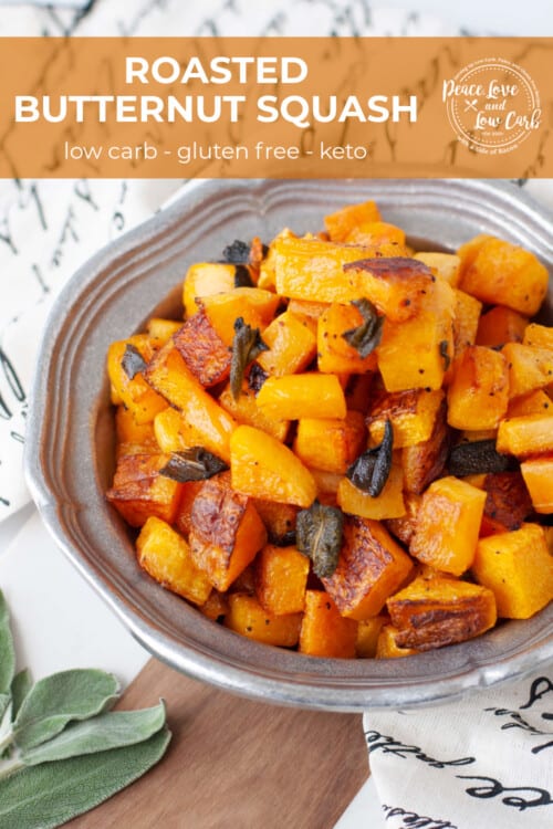 A metal serving dish with a side of roasted butternut squash with sage.