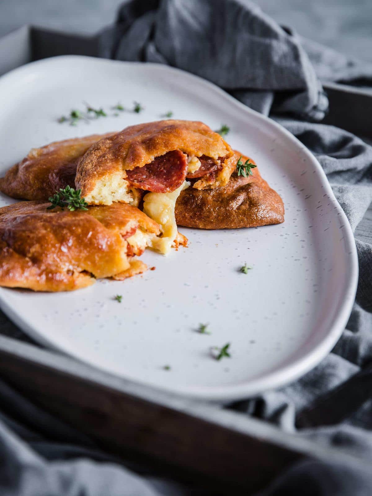 melty cheese and pepperoni inside a keto pepperoni pizza hot pockets