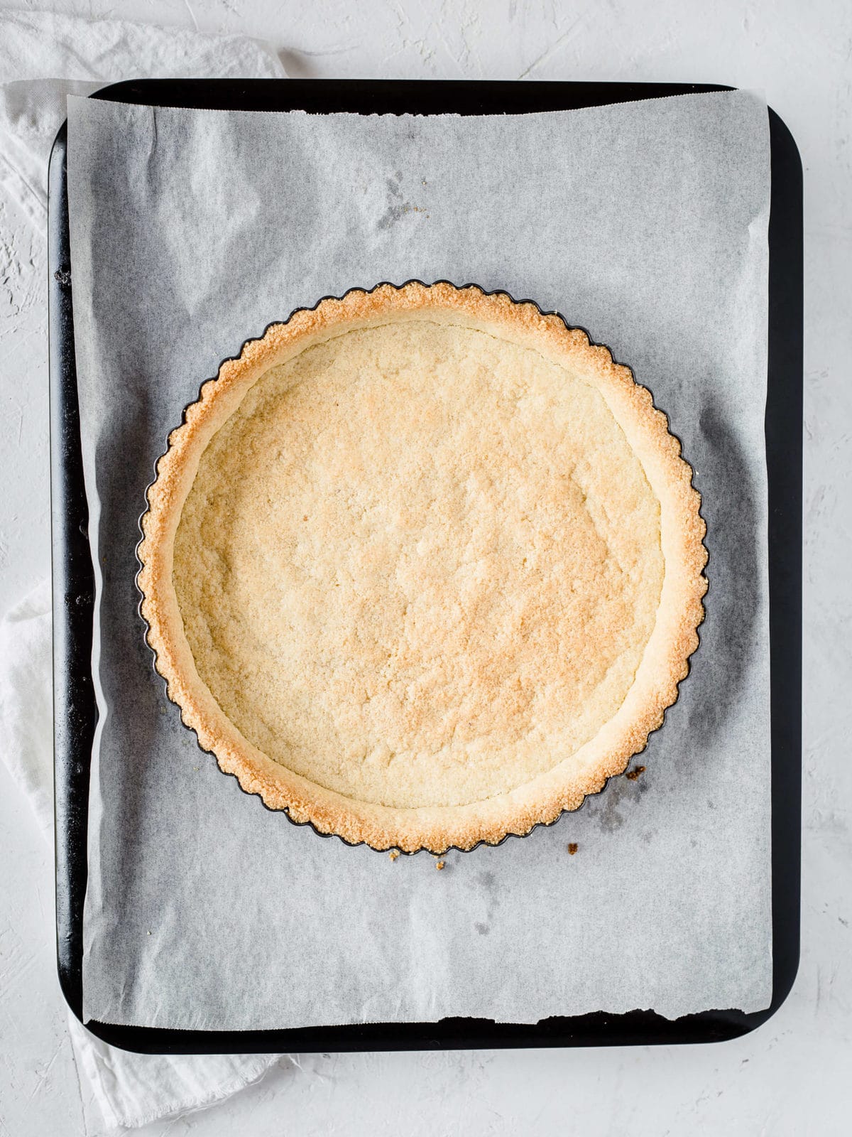 a gluten free pie crust in a pie tin, freshly baked and out of the oven.