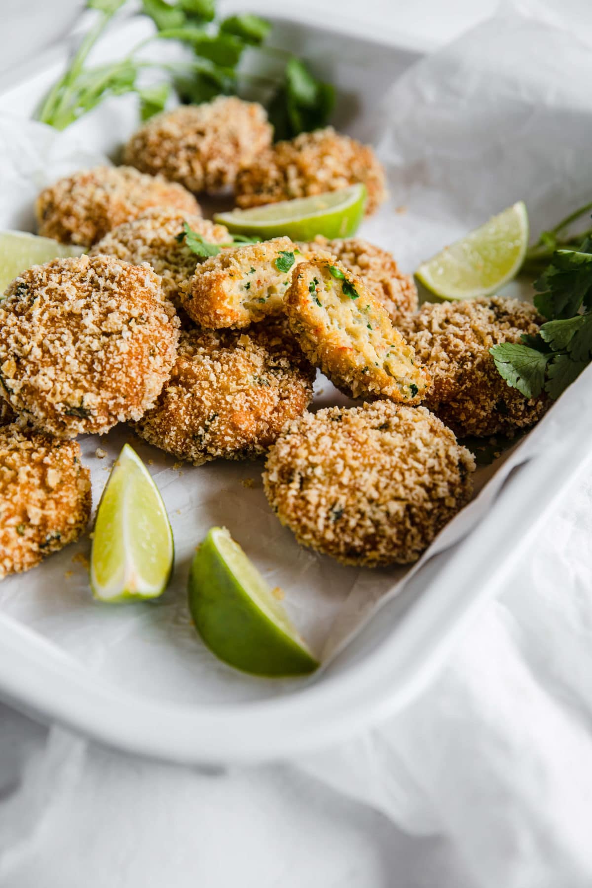 a platter of low carb shrimp cakes with limes