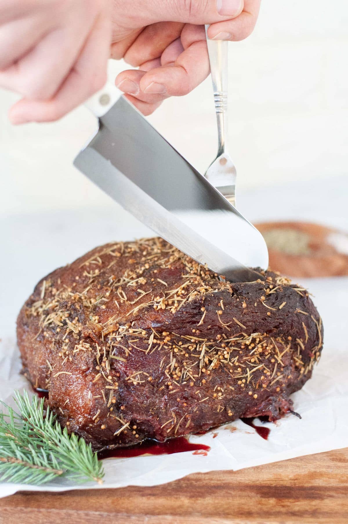 a smoked ribeye roast, seasoning with mustard seed rosemary, salt, pepper, onion, and garlic. 