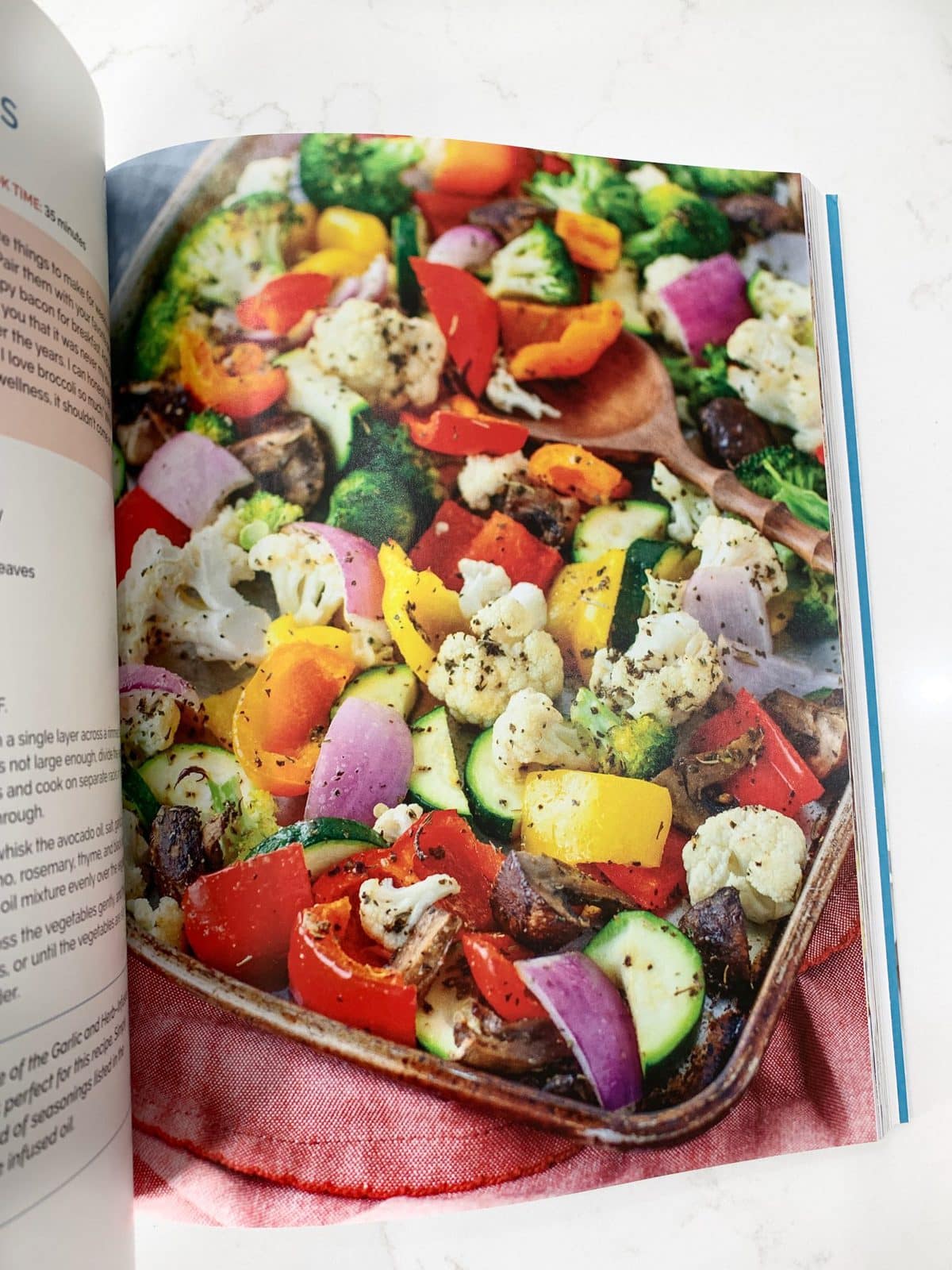 flat lay of a Whole30 side dish recipe in a cookbook - oven roasted vegetables