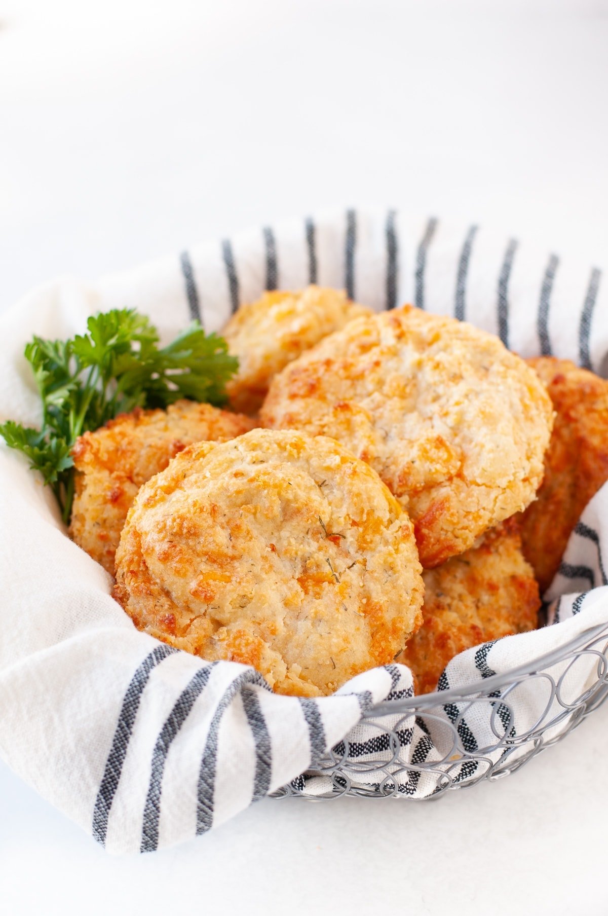 Basket of warm gluten free cheesy biscuits 