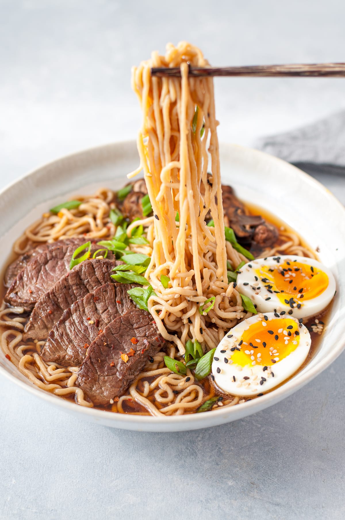 Keto Ramen with Shirataki noodles, soft-boiled eggs, mushrooms, and green onions