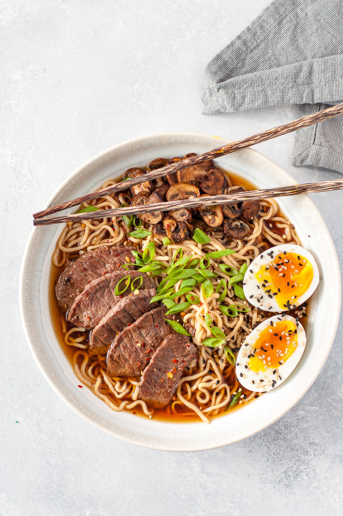 overhead shot of a bowl of ramen - broth, beef eggs, mushrooms and Shirataki noodles