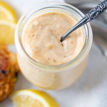 Remoulade sauce served with lemon and shrimp cakes