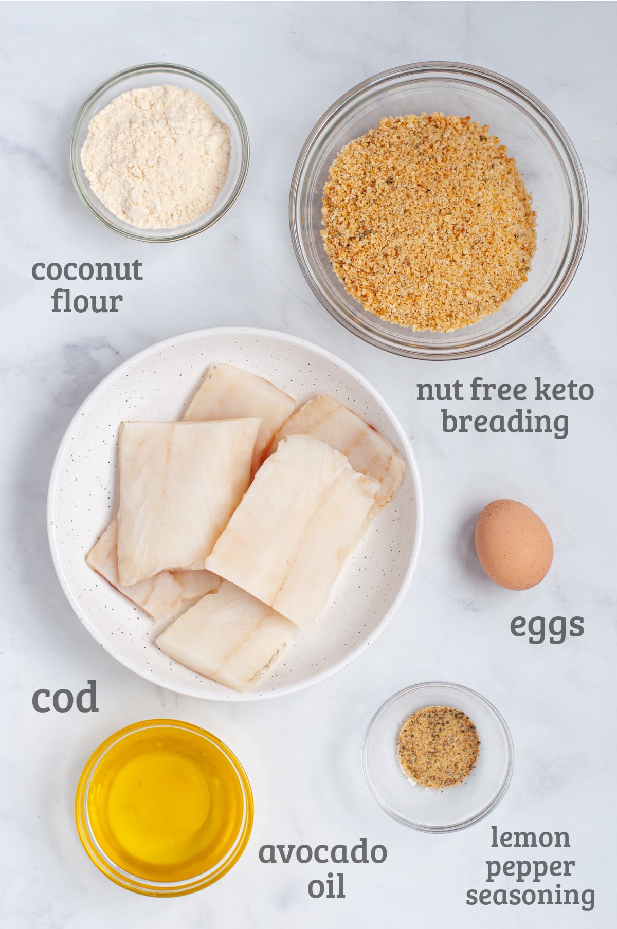 ingredients for air fryer fish nuggets - cod, breading, eggs, seasoning, coconut flour