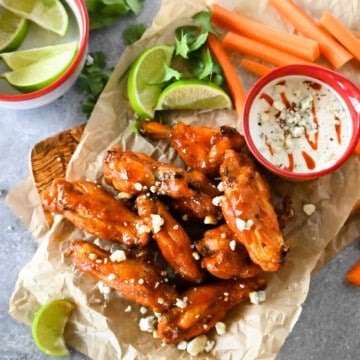 Air Fried Chicken Wings served with blue cheese, ranch, carrots, and limes