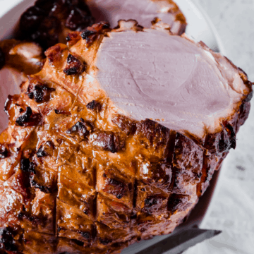 keto glazed ham, fresh out of the oven with a crispy skin, tender and juicy on the inside.