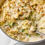 a skillet full of low carb tuna casserole, rich and creamy sauce, baked golden brown with cheese.