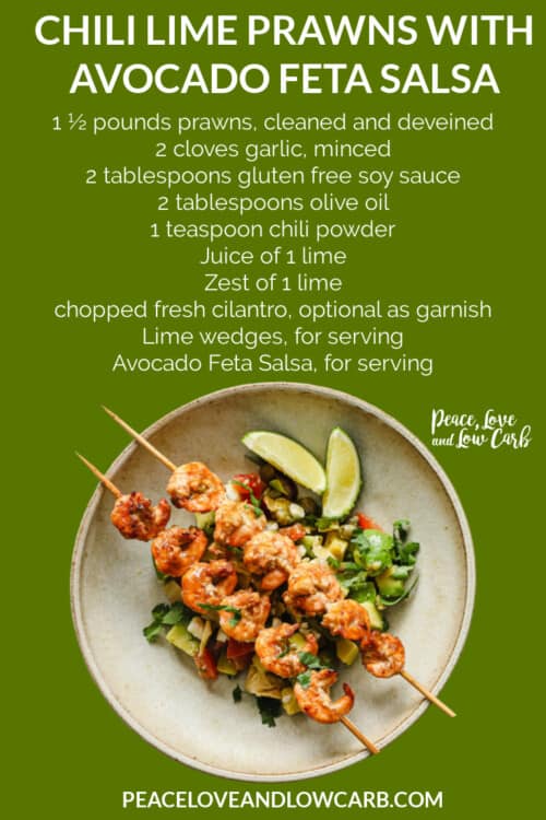 grilled prawns on top of an avocado feta salsa, plated with lime wedges