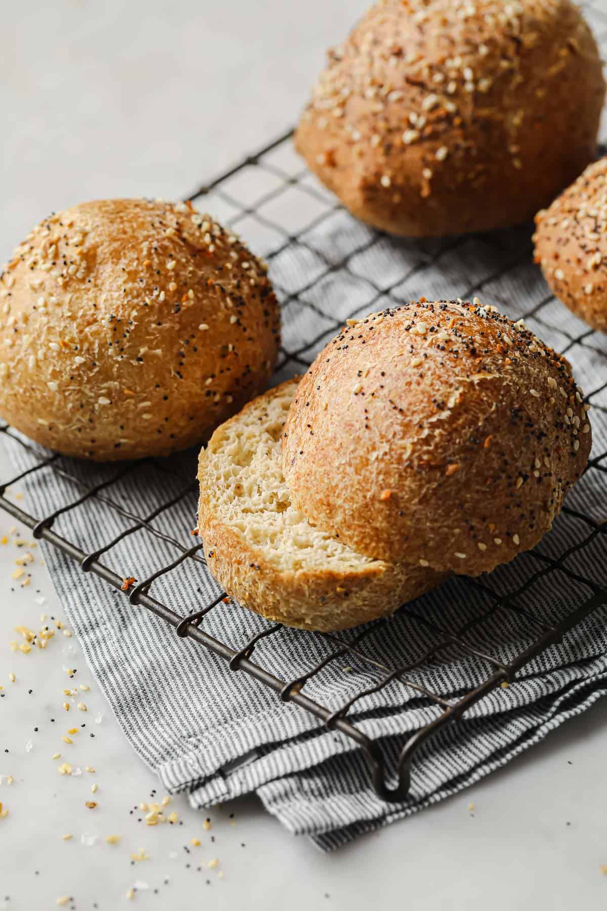low carb sandwich rolls topped with everything bagel seasoning in a basket lined with parchment paper