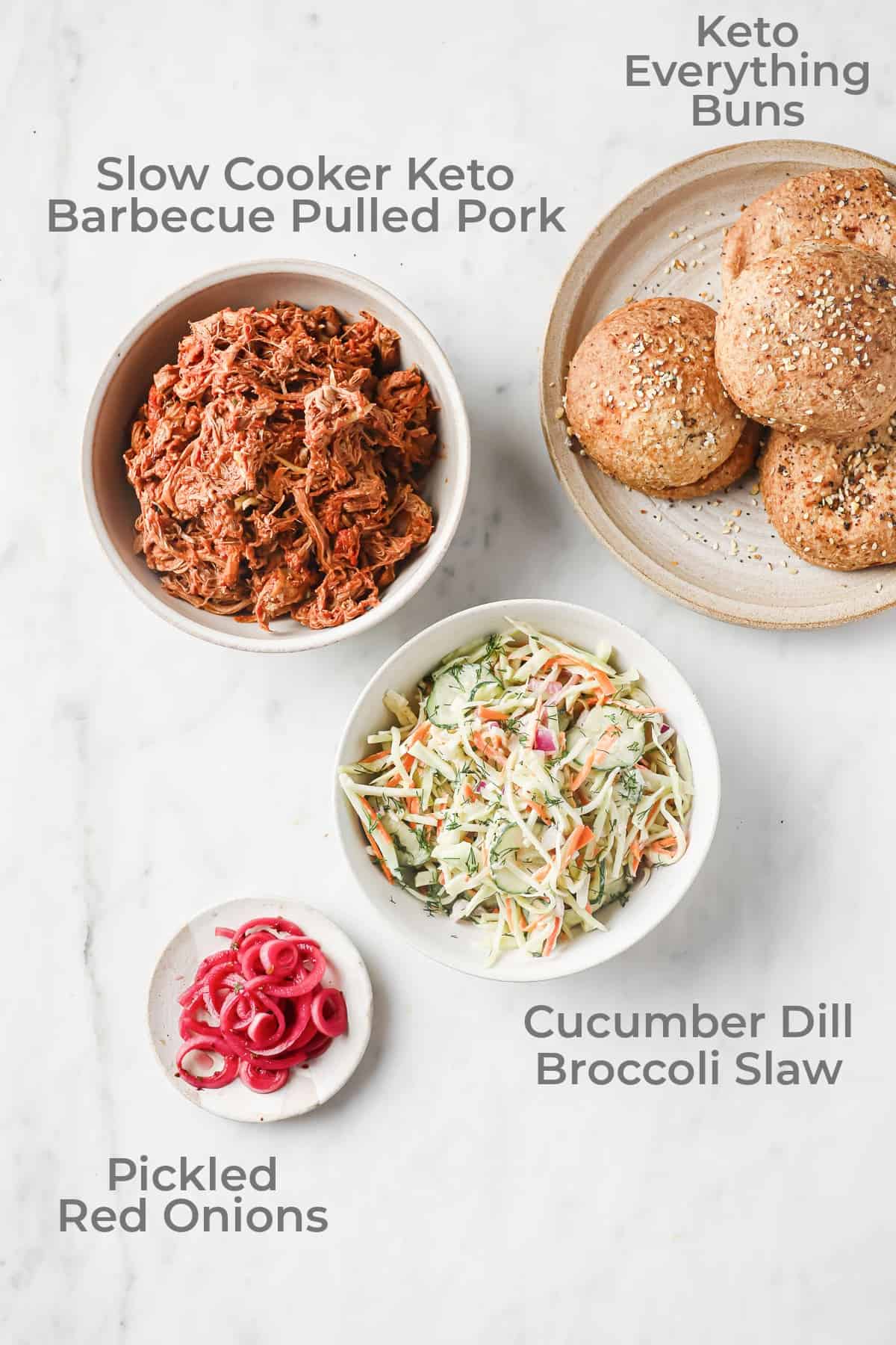 Ingredients for barbecue pulled pork sandwiches - slaw, pulled pork, pickled red onions, keto bread