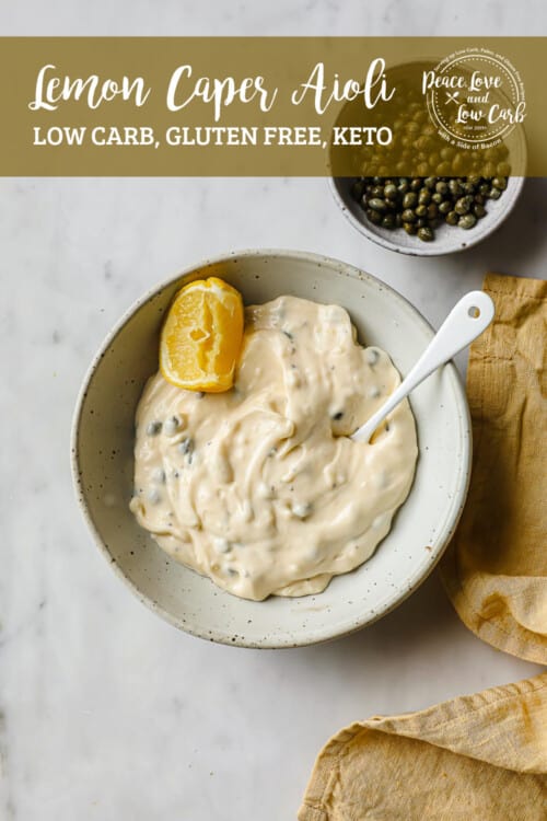 a ceramic bowl, full of lemon caper aioli, garnished with a lemon and capers