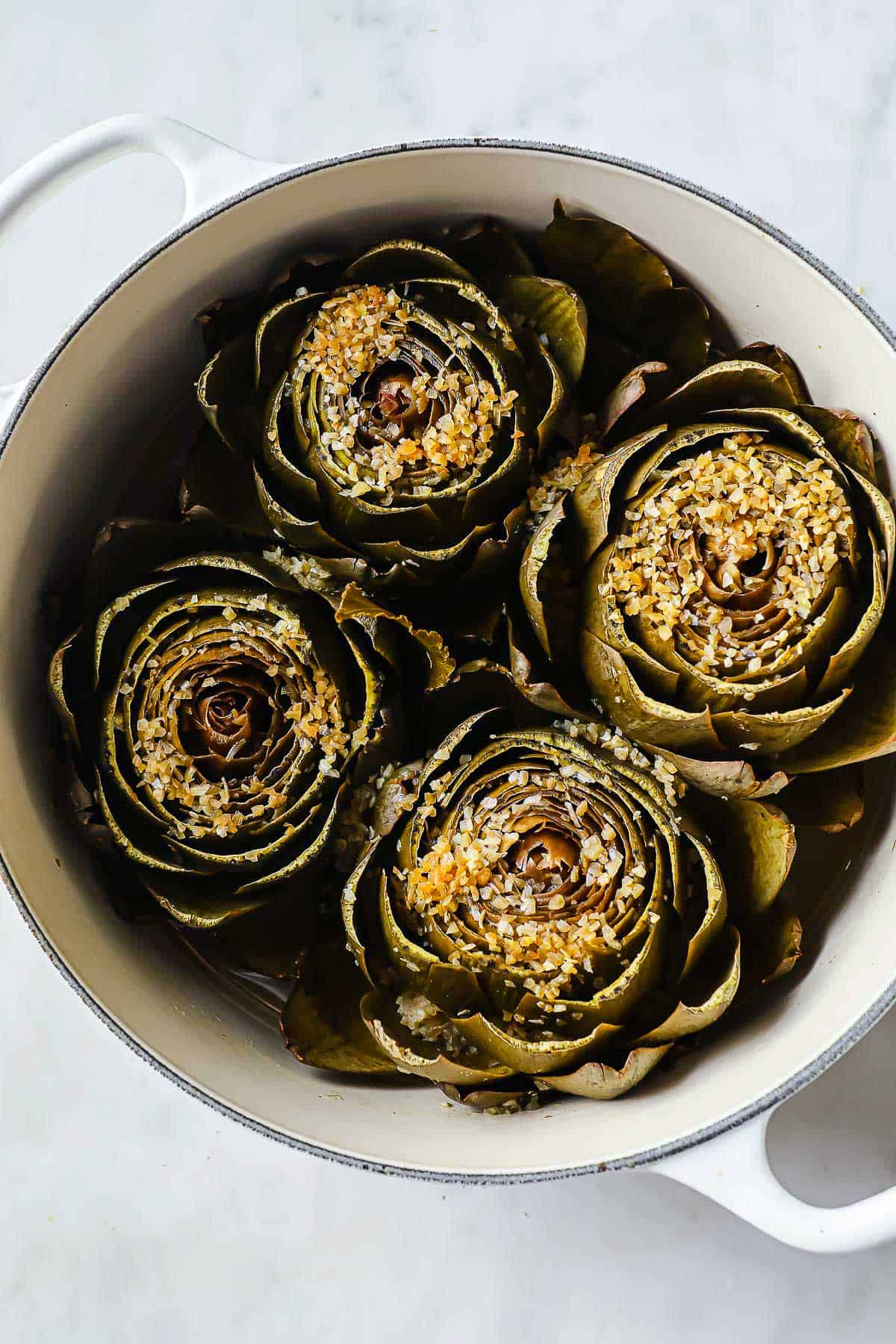 cooked artichokes, steamed in a dutch oven with chicken stock, spices and seasonings