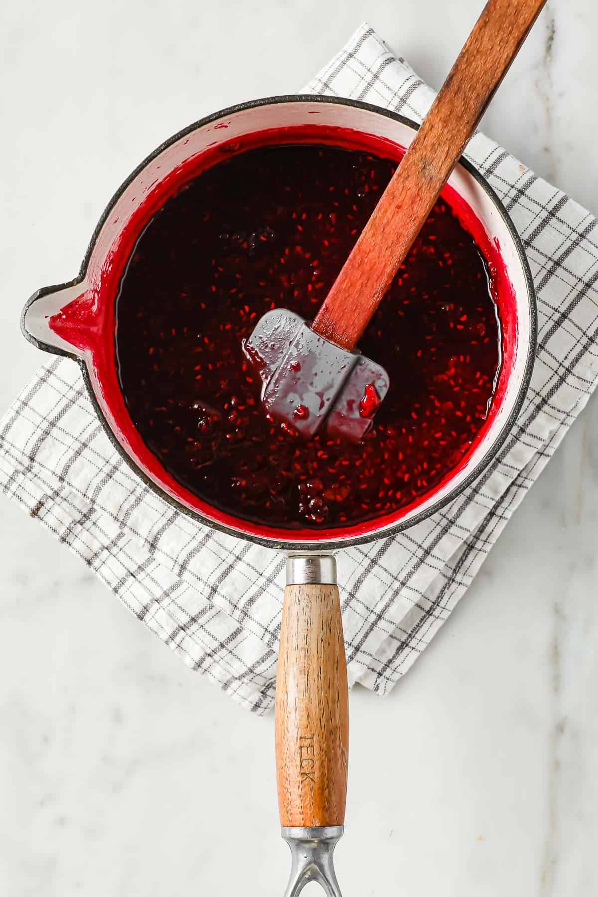 A sauce pan with homemade low carb mixed berry jelly