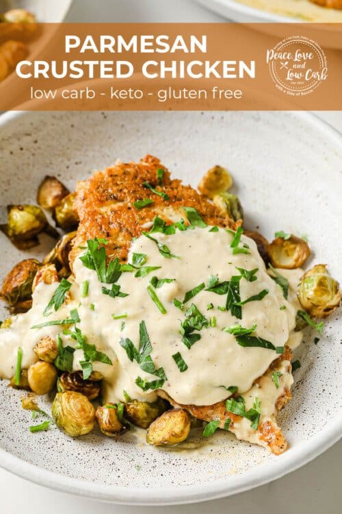 a white pan with crispy chicken breasts and a velvety cream sauce, garnished with parsley