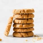 a stack of low carb peanut butter cookies, surrounded by crumbs