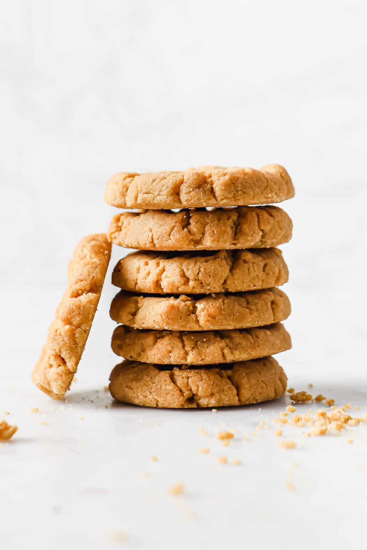 a stack of low carb and gluten free peanut butter cookies, piled high