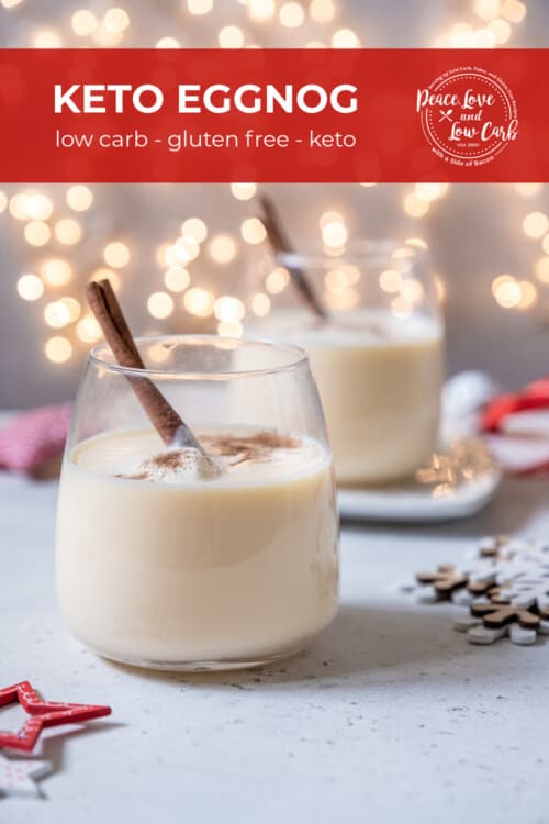 Two stemless wine glasses full of homemade low carb eggnog, garnished with nutmeg and a cinnamon stick.