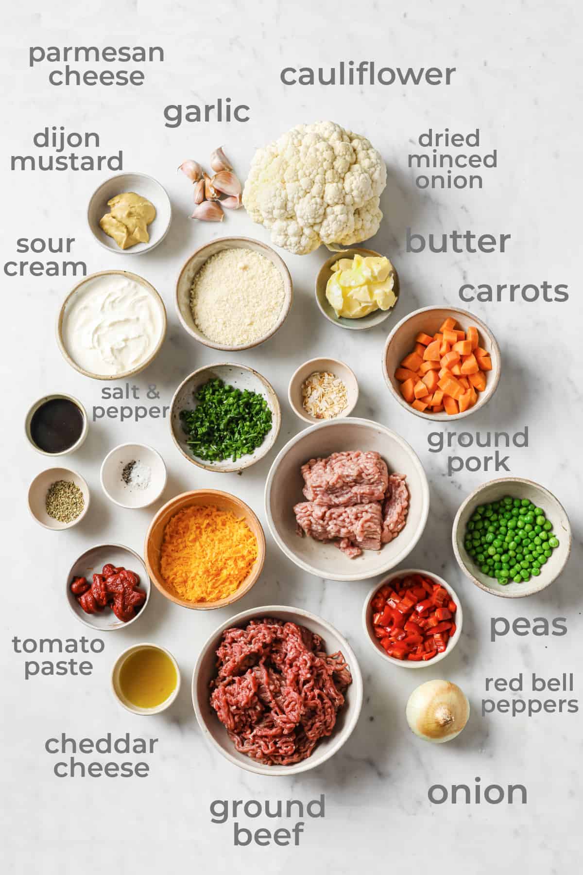 Ingredients all laid out in individual bowls to make a low carb and gluten free shepherds pie recipe.