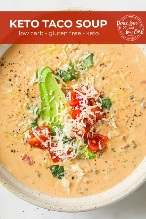 A bowl of creamy taco soup made with ground beef, onion, garlic, cream cheese, beef stock, diced tomatoes and green chilies. Garnished with avocado, tomato, cheese, and cilantro.