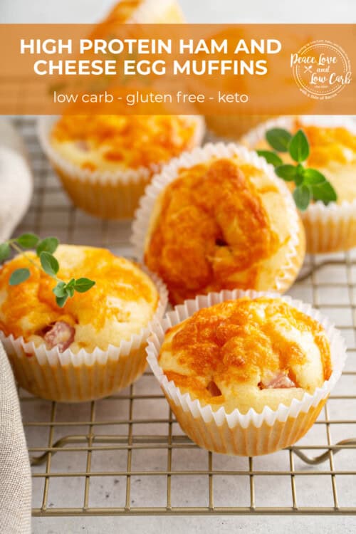 Ham and Cheese Egg muffins, garnished with fresh herbs, cooling on a wire rack.